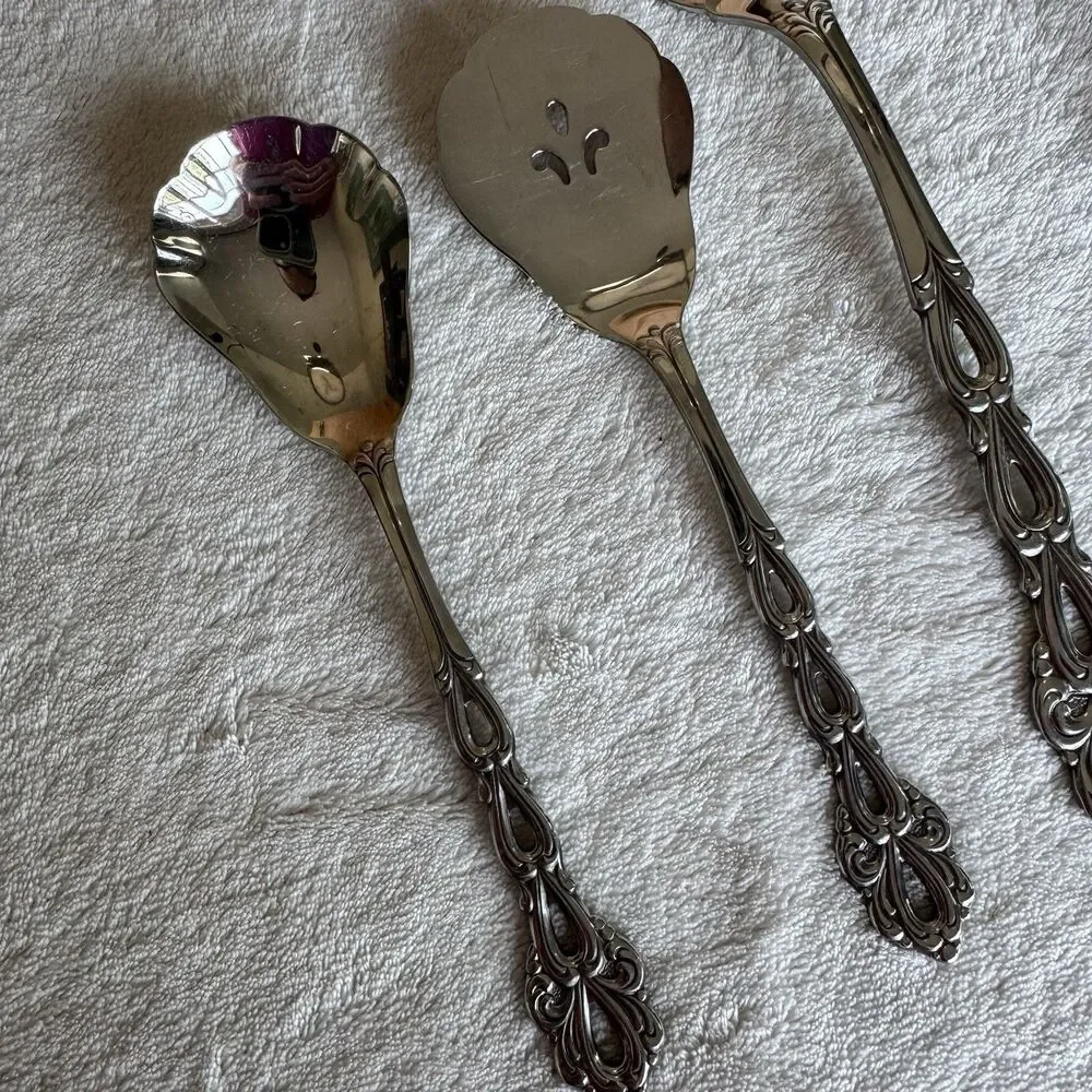 Vintage 7-piece Oneida Community Chandelier serving utensil set in stainless MCM
